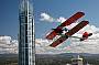 view the Q1 building in a Tiger Moth