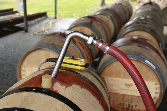 pumping wine into the barrels