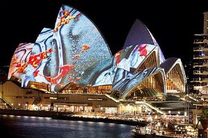 Sails of Sydney Opera House bathed in light during Vivid