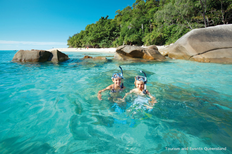 two children Snorkelling off Nudey beach Fitzroy Island