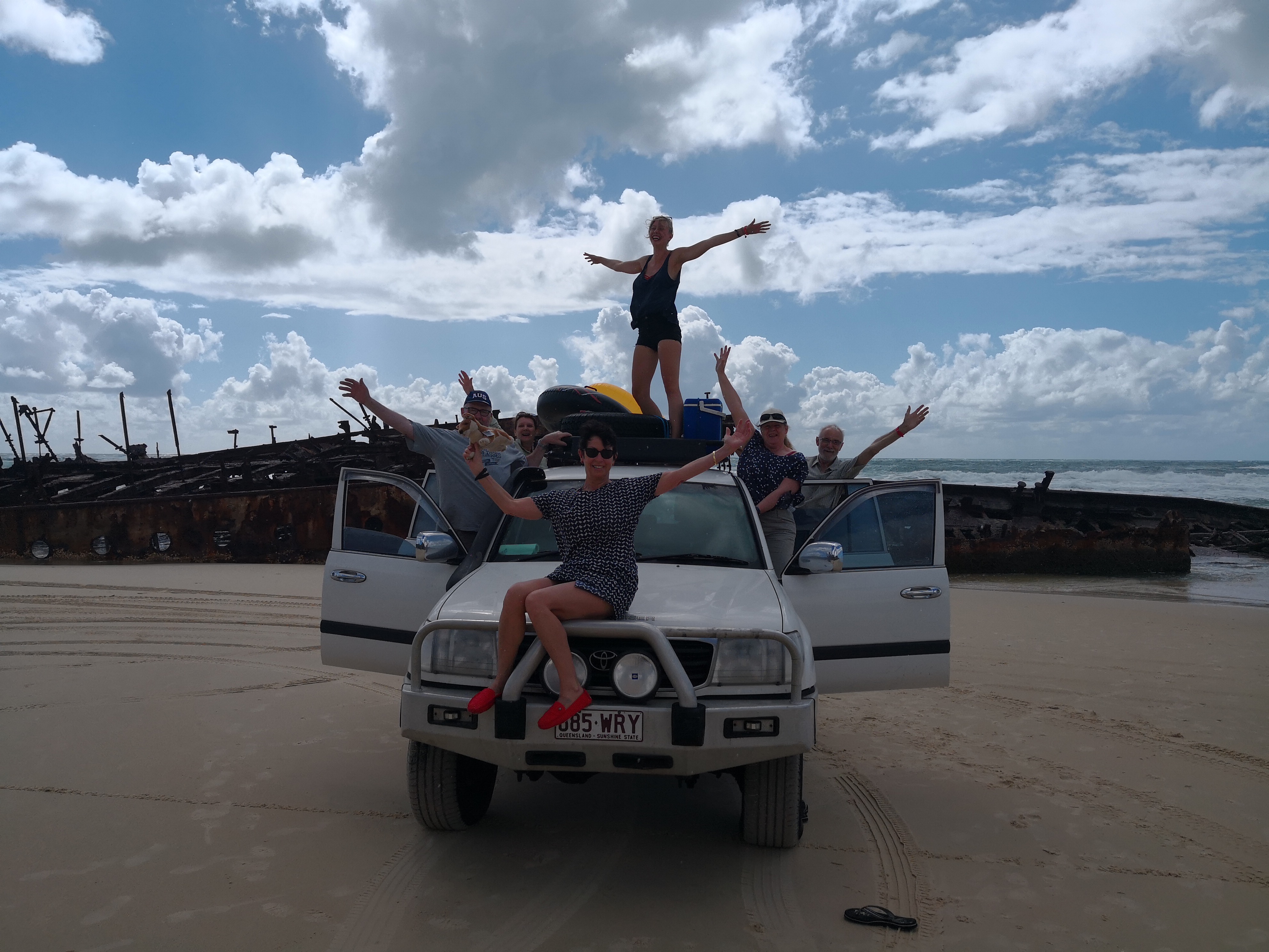 Group photo at Maheno Shipwreck Our group all standing on the 4WD in front of the Maheno Shipwreck for a fun group photo