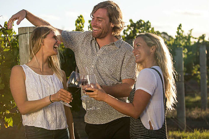 Three friends enjoying some wine together