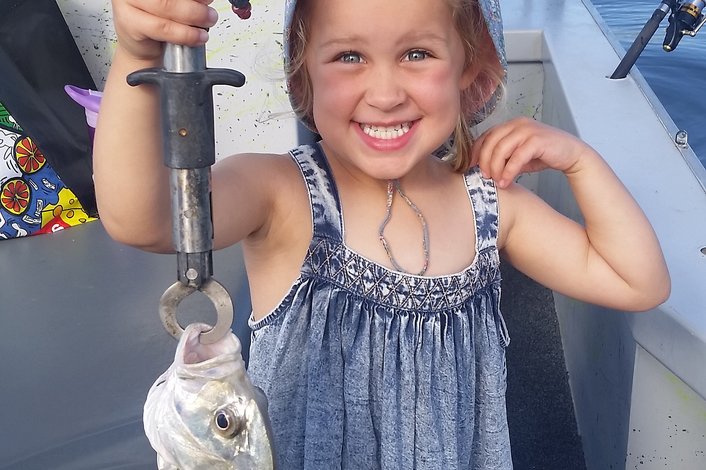 Evie and her Trevally while estuary fishing