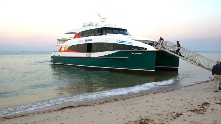 Tiwi Island ferry moored near the beach