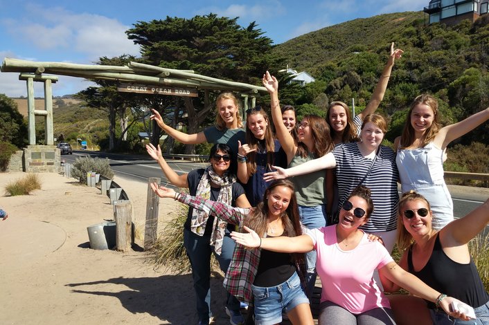 Group picture in front of Great Ocean Road sign