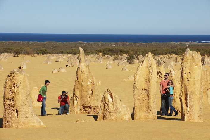 Golden limestone structures, known as The Pinnacles