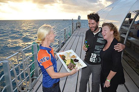 Witness the sunset over the Great Barrier Reef and enjoy canapes