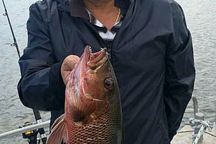 Frank and his Mangrove Jack while estuary fishing